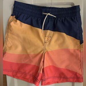 Old Navy, coral and navy colored swim trunks. Boy’s size 10–12
